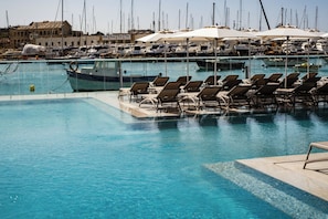 Indoor pool, outdoor pool, open 9:00 AM to 6:00 PM, pool umbrellas