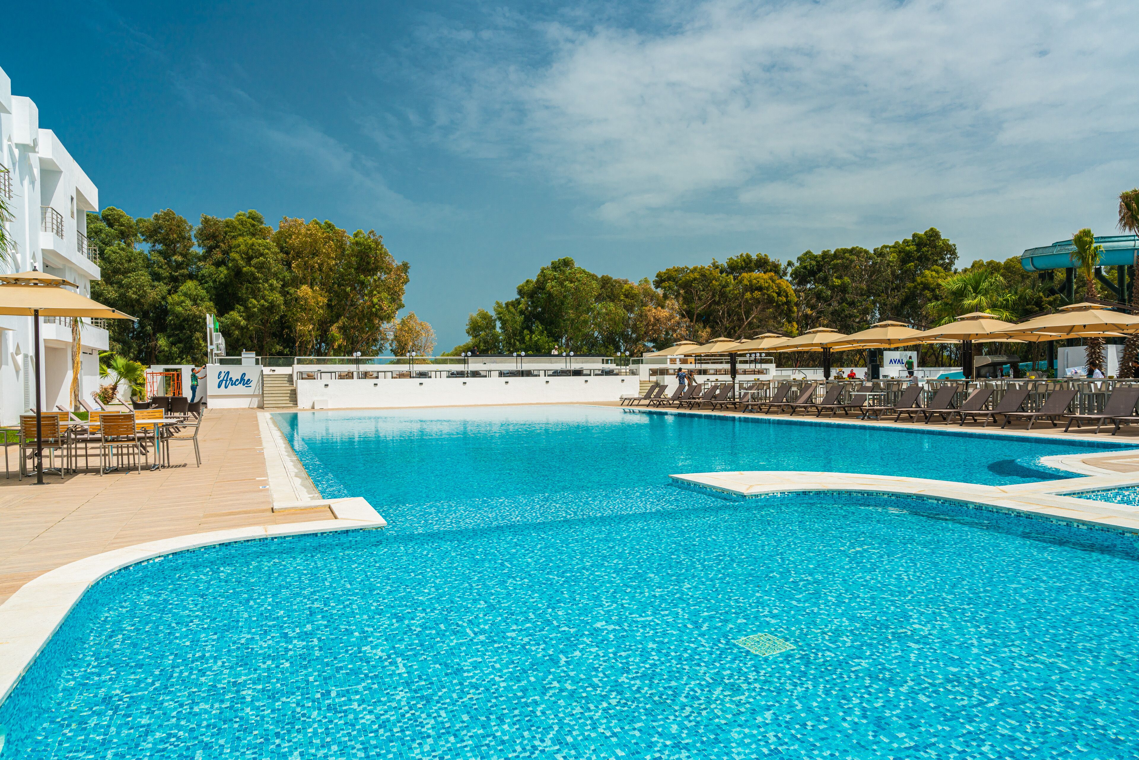 Outdoor pool, pool umbrellas, sun loungers