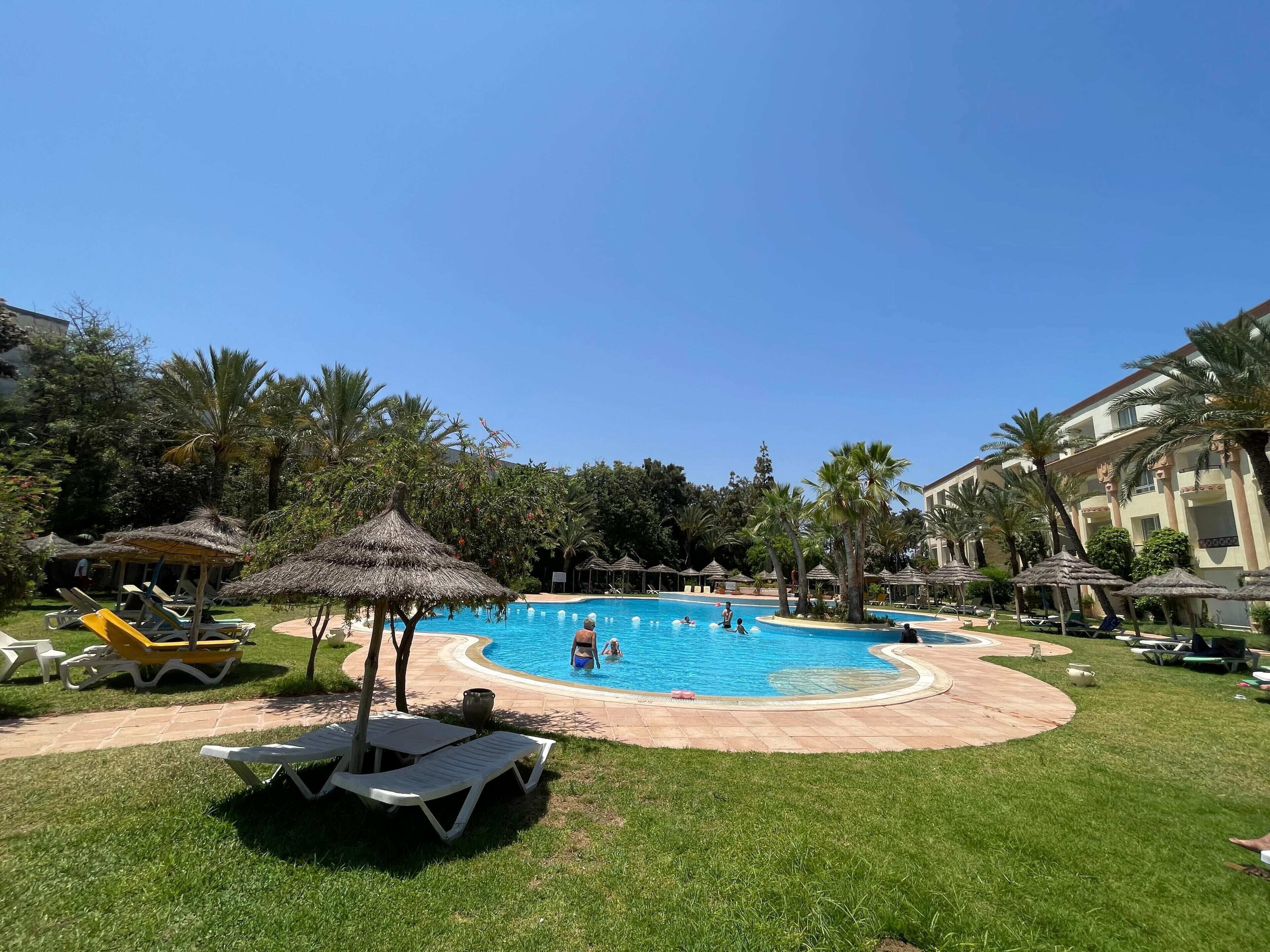 Indoor pool, outdoor pool, pool umbrellas