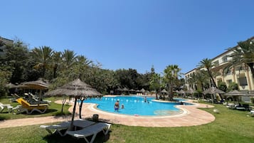 Indoor pool, outdoor pool, pool umbrellas