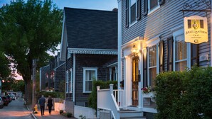 A historic building with a sign for Brass Lantern Inn. - Brass Lantern Inn (Nantucket)