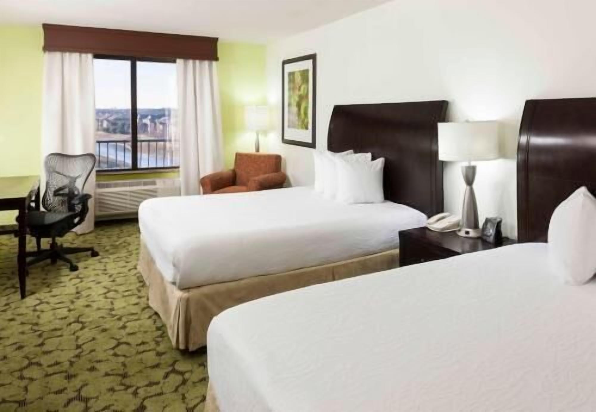 Premium bedding, desk, laptop workspace, iron/ironing board
