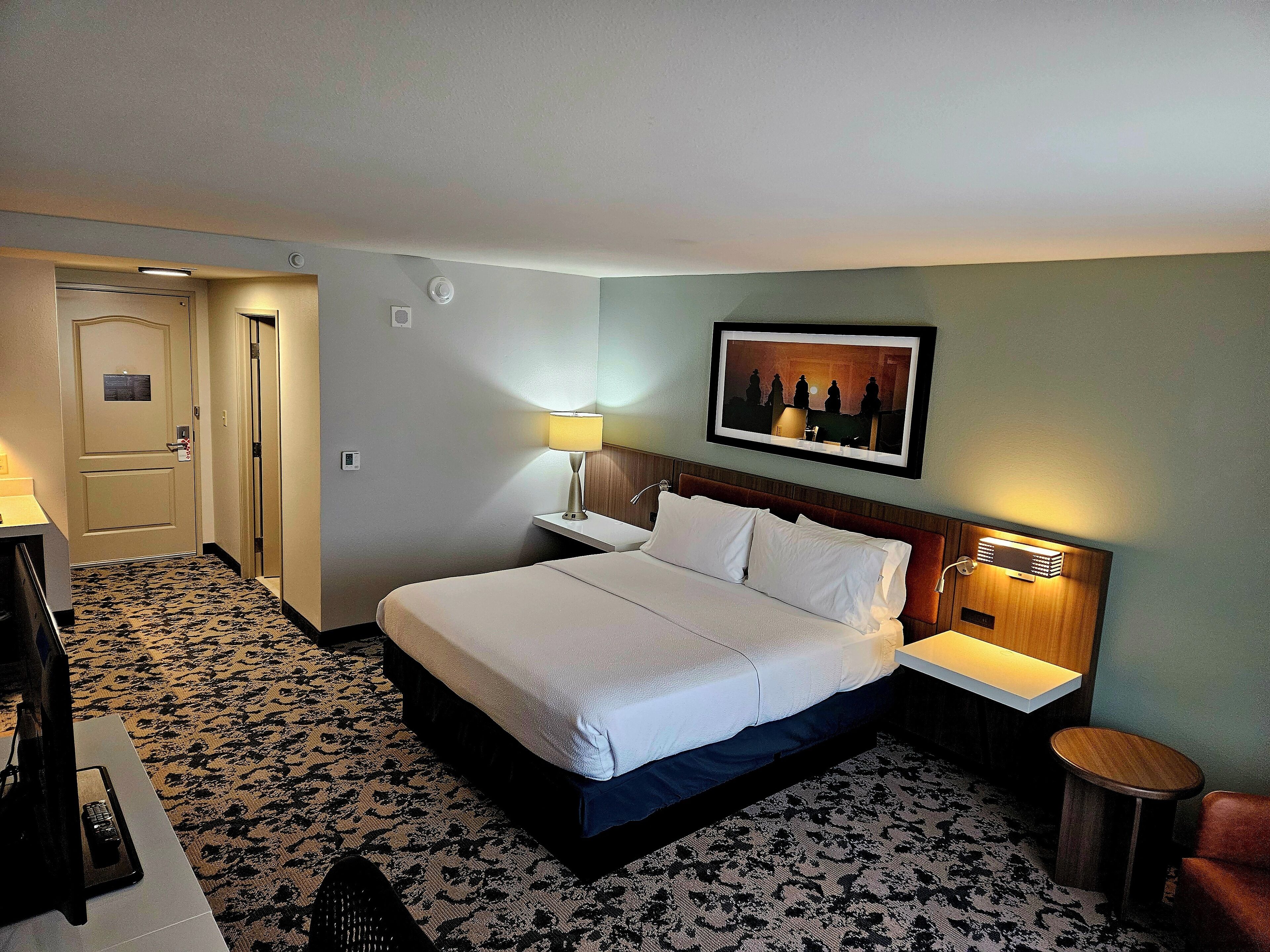 Premium bedding, desk, laptop workspace, iron/ironing board