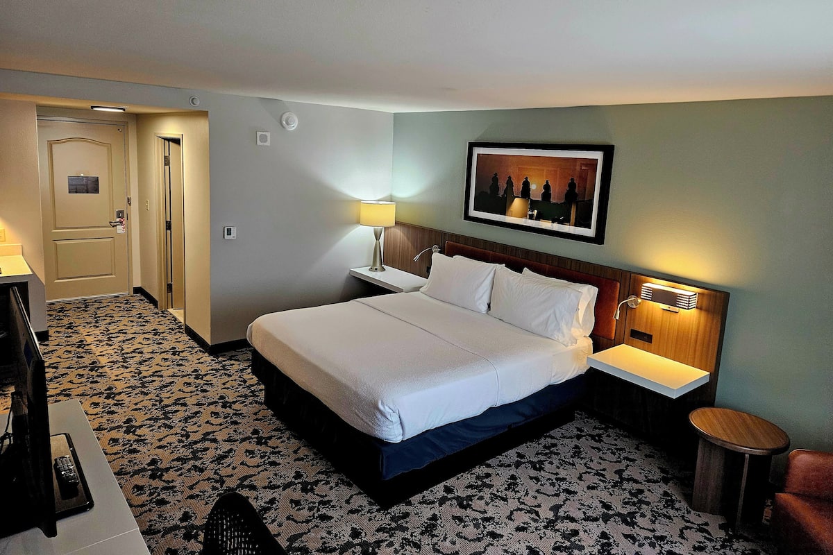 Premium bedding, desk, laptop workspace, iron/ironing board