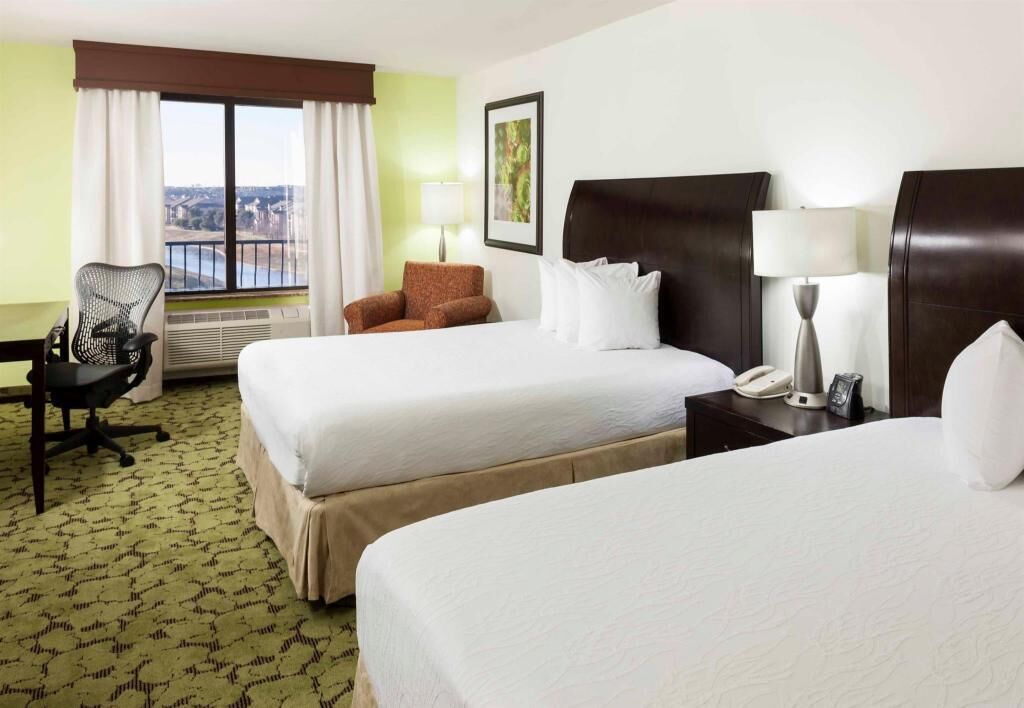Premium bedding, desk, laptop workspace, iron/ironing board