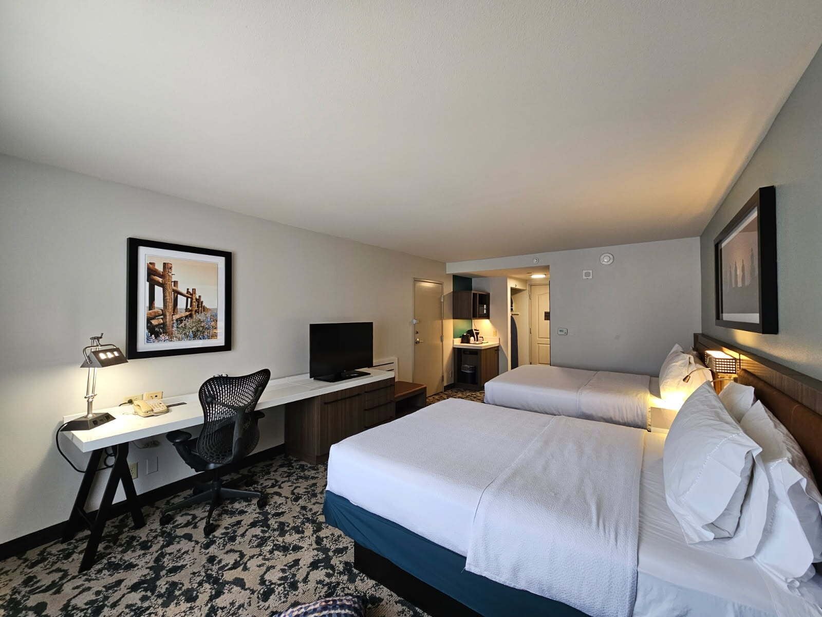 Premium bedding, desk, laptop workspace, iron/ironing board