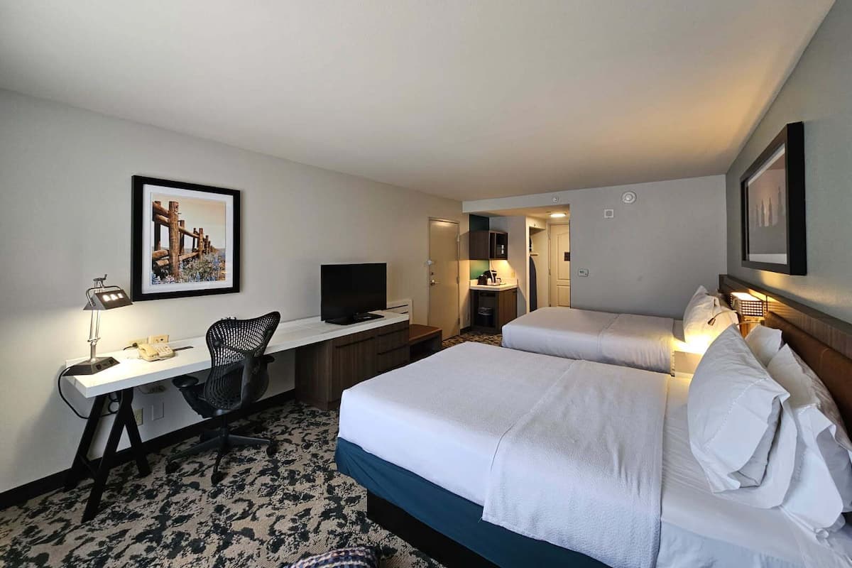 Premium bedding, desk, laptop workspace, iron/ironing board