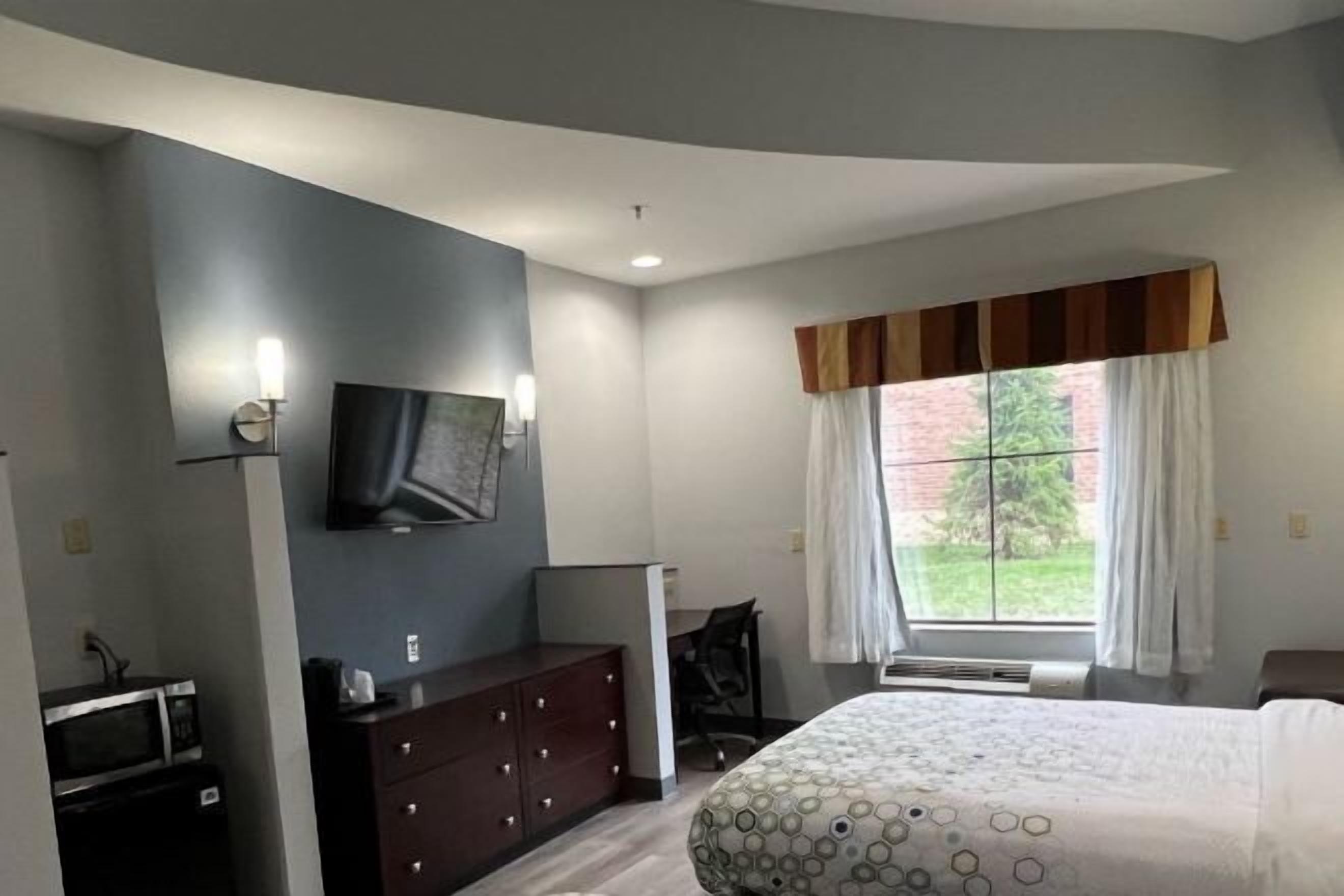 Desk, laptop workspace, blackout curtains, iron/ironing board