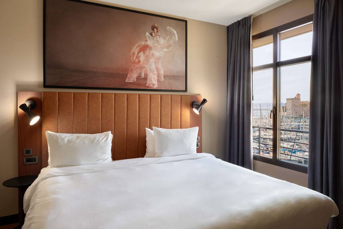 premium room (port view) | 1 bedroom, hypo-allergenic bedding, minibar, in-room safe