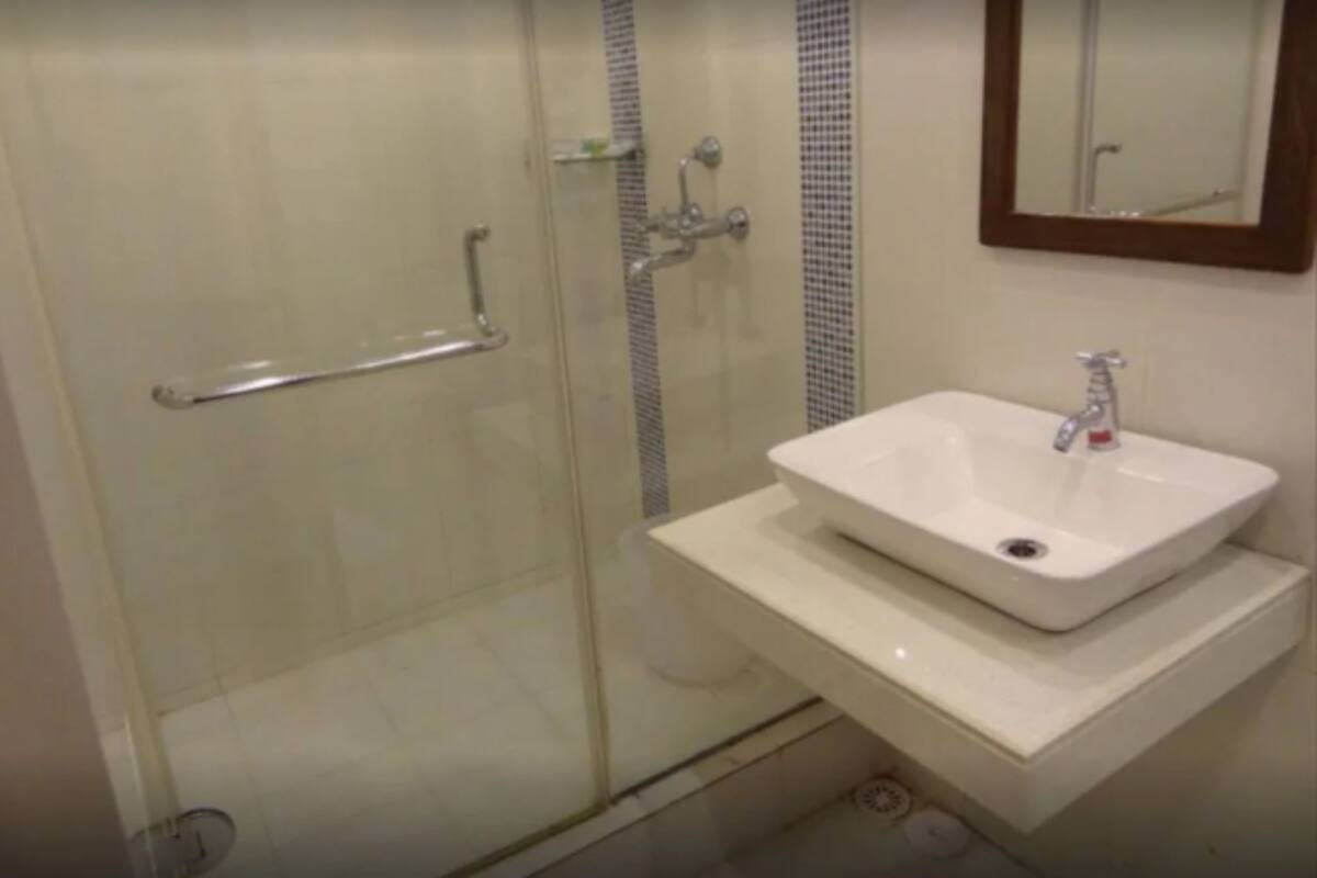 shower, rainfall showerhead, designer toiletries, towels