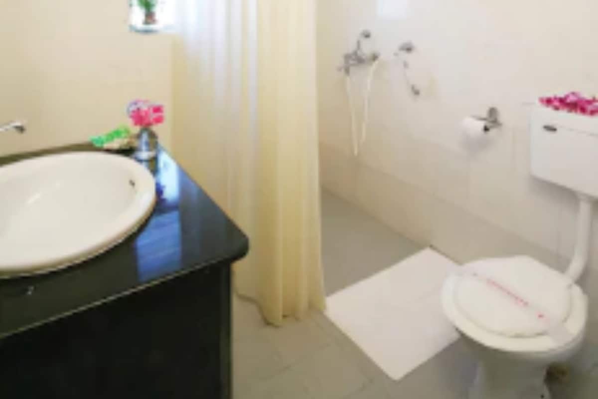 shower, rainfall showerhead, designer toiletries, towels