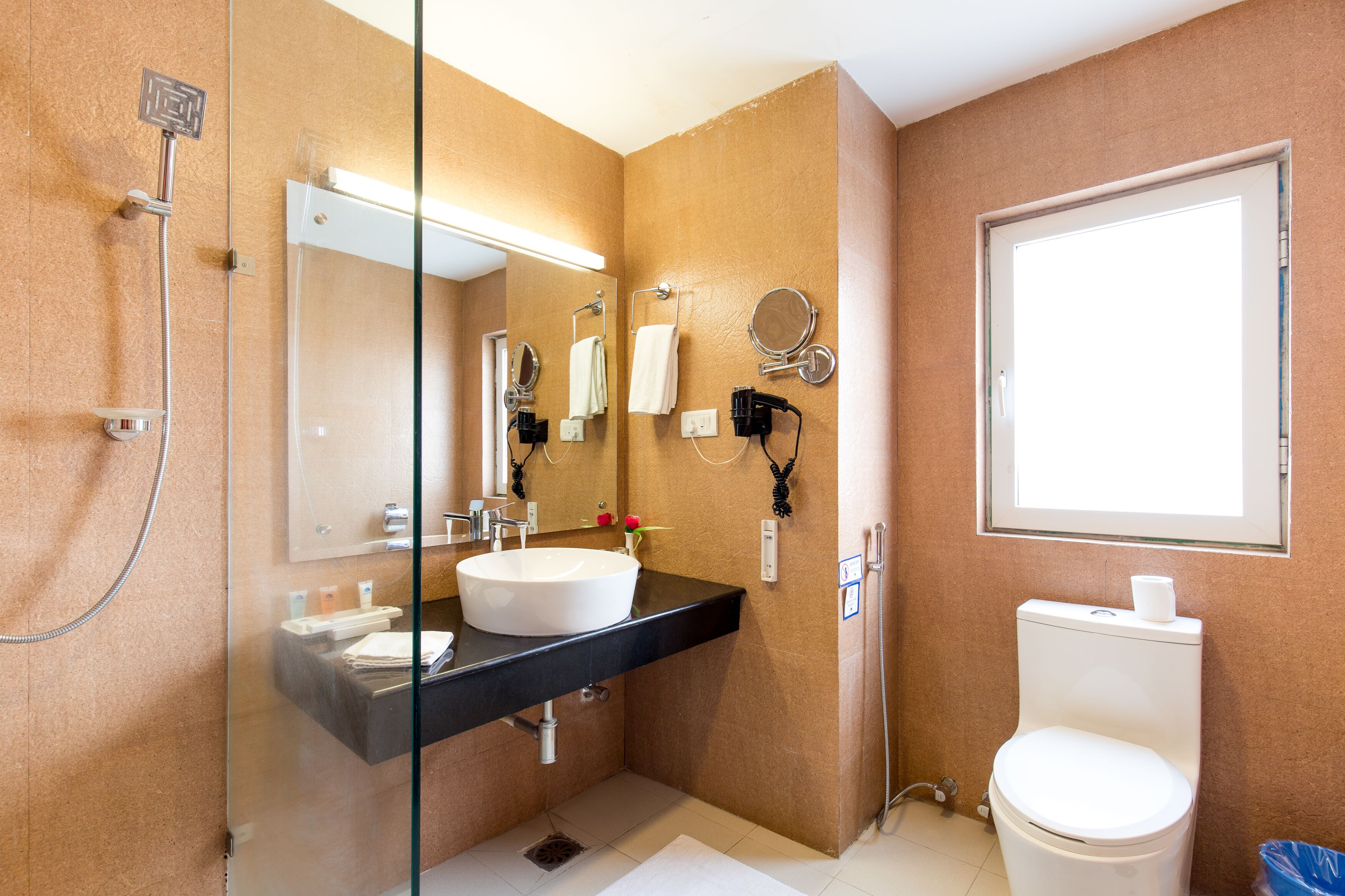 eco-friendly toiletries, hair dryer, bathrobes, slippers