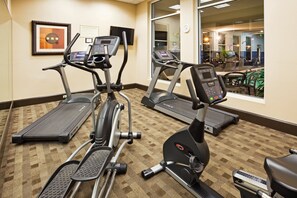 A gym with treadmills, stationary bikes, and elliptical machines. - Holiday Inn Hotel & Suites Beaufort at Highway 21 by IHG (Beaufort)