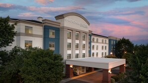 A modern hotel with a prominent marquee sign, multiple floors, and a covered entrance area. - SpringHill Suites by Marriott Portland Vancouver (Vancouver)