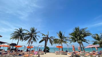 On the beach, beach towels, beach bar, rowing