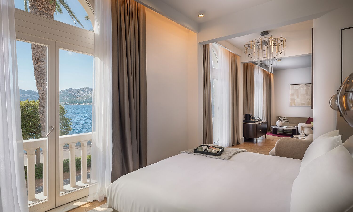 Luxury suite with sea view balcony | Premium bedding, minibar, in-room safe, laptop workspace