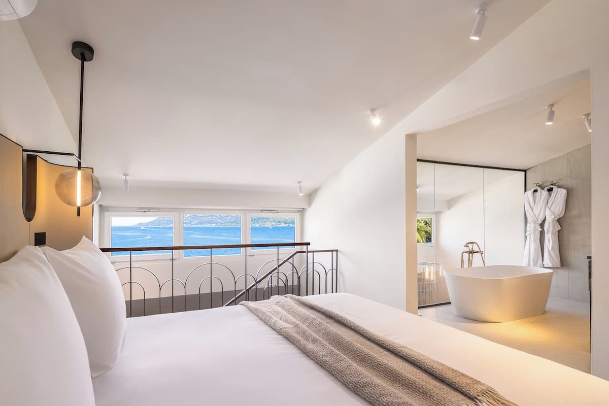 Deluxe Duplex Suite with Sea View | Premium bedding, minibar, in-room safe, laptop workspace
