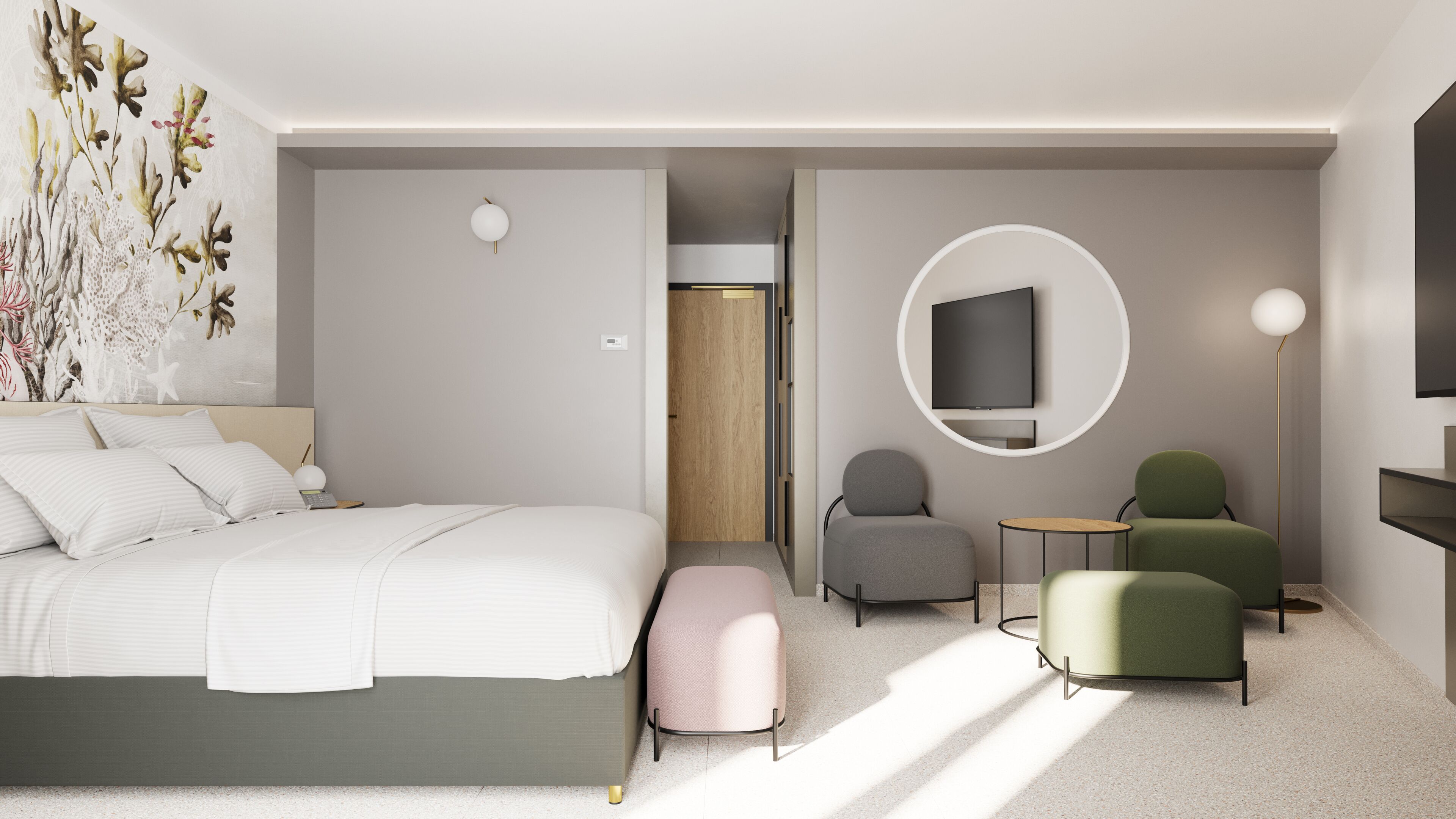 A modern hotel room with a large bed, a seating area with two chairs, a small table, and a TV mounted on the wall.