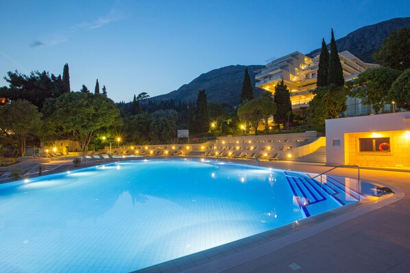 Seasonal outdoor pool, pool umbrellas, pool loungers