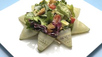 A salad on a white plate.
