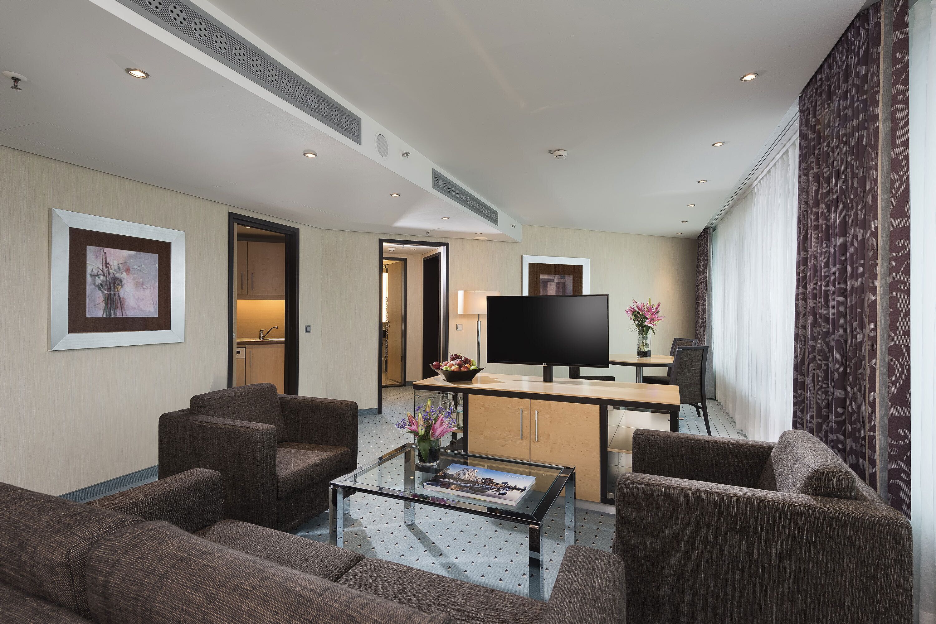 master suite | living area | flat-screen tv