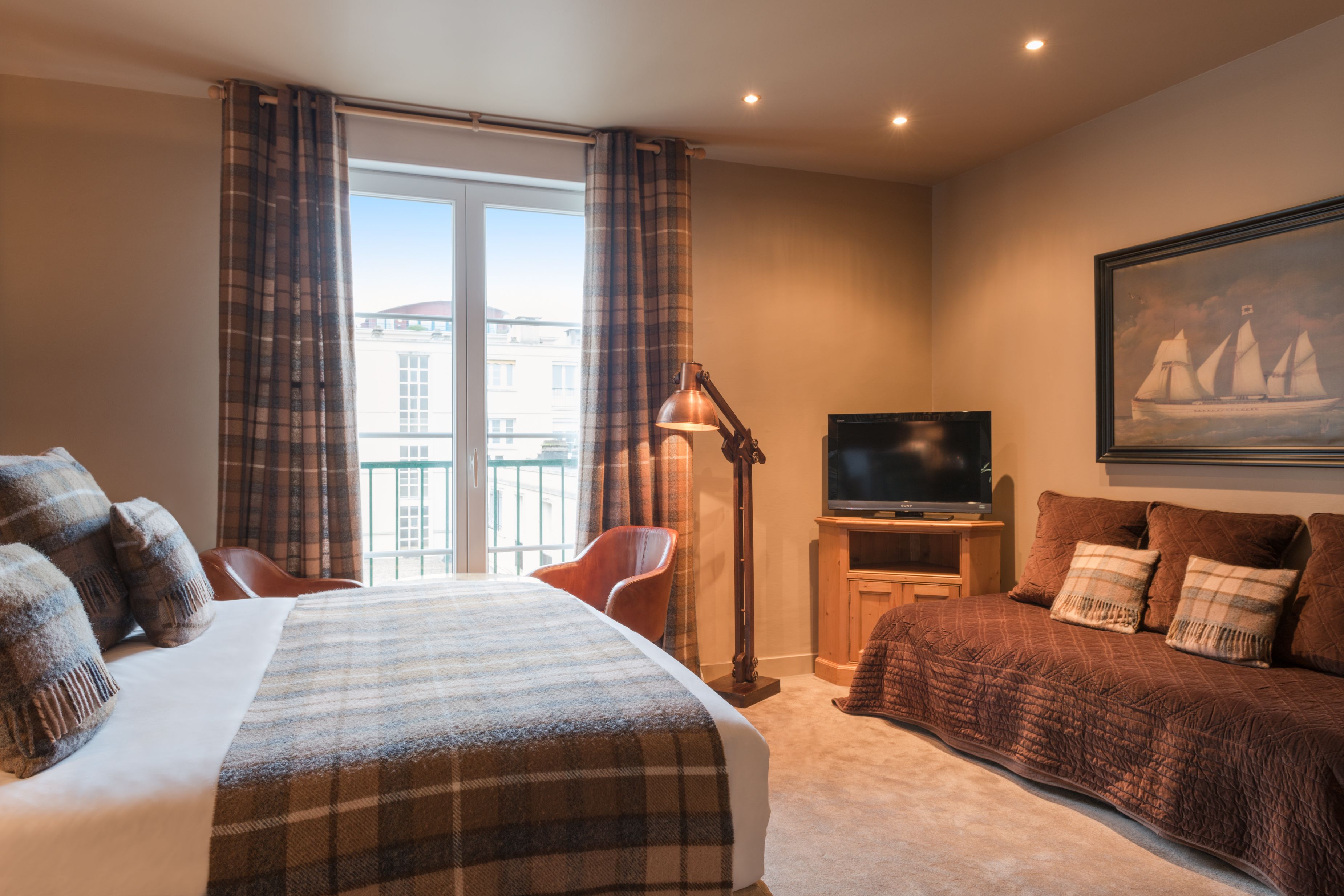 family room, 2 bedrooms | premium bedding, pillow-top beds, in-room safe, desk