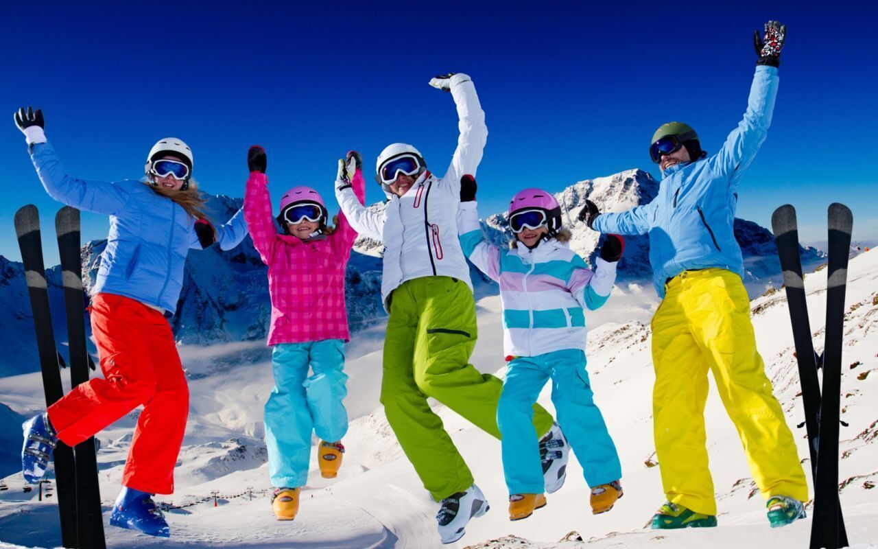 A group of people skiing on a snowy mountain.