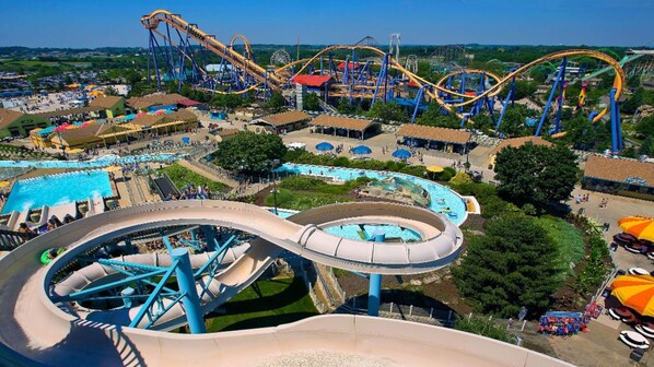 A water park with a large water slide, multiple roller coasters, and a pool area. - Holiday Inn Express & Suites Allentown West by IHG (Allentown)