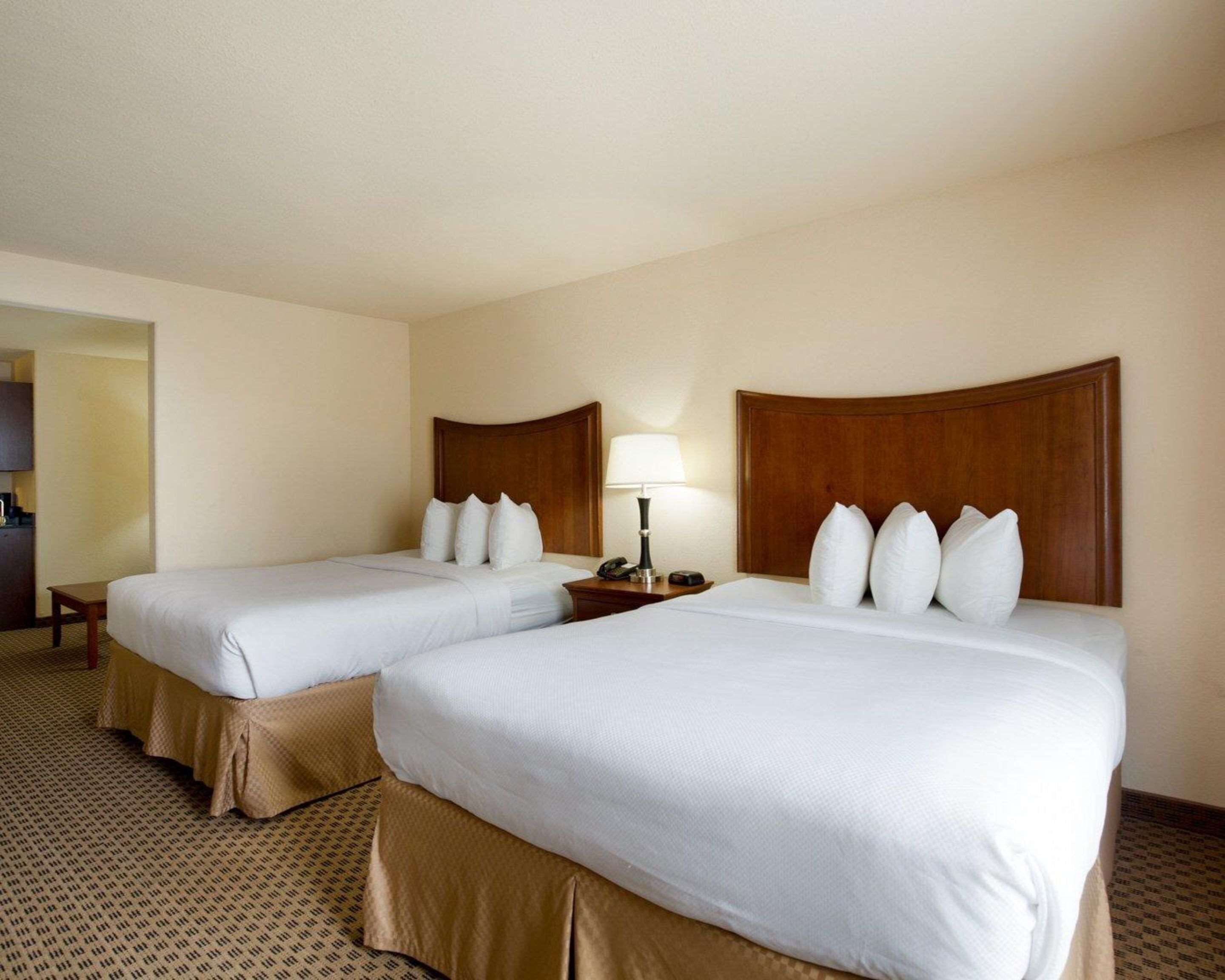 Suite, 2 Queen Beds, Non Smoking | Desk, blackout drapes, iron/ironing board, free cribs/infant beds