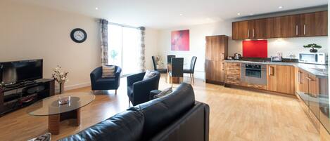 Deluxe Apartment | Living area | 32-inch TV with digital channels