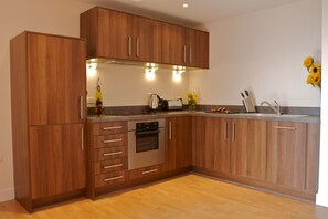 Full-sized fridge, microwave, oven, dishwasher