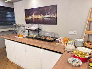 A breakfast buffet with various food items and condiments. - Lord Nelson Hotel – Lime Street Station Liverpool by Compass Hospitality (Liverpool)