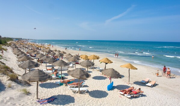 Private beach, white sand, sun-loungers, beach umbrellas