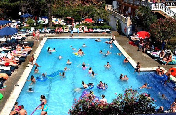Seasonal outdoor pool, pool umbrellas, pool loungers