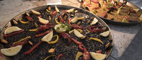 A seafood dish with lemon slices and herbs.