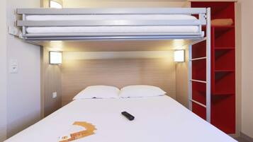 A bunk bed with a white mattress, two pillows, a remote control, and a red shelving unit beside it.