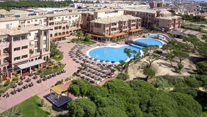 A resort with multiple swimming pools, outdoor seating areas, and a variety of building styles. - Barceló Punta Umbria Beach Resort (Punta Umbría)