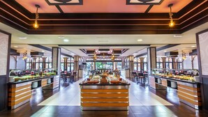 A buffet area with multiple food stations and seating arrangements. - Barceló Punta Umbria Beach Resort (Punta Umbría)