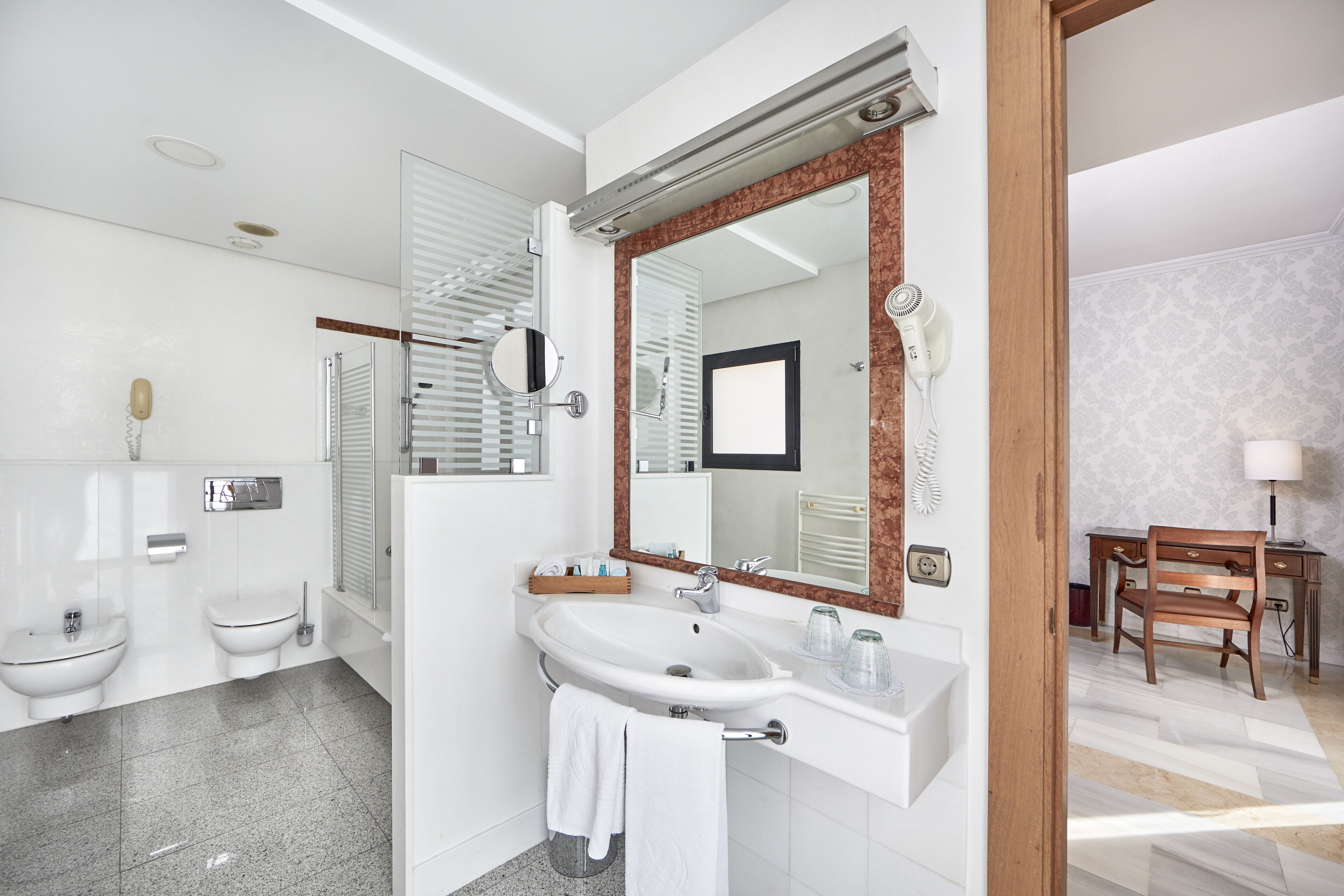 deep-soaking bathtub, hair dryer, towels, soap