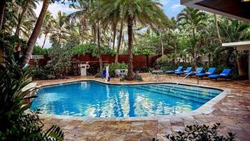 Outdoor pool, open 7:00 AM to 7:00 PM, pool umbrellas, pool loungers