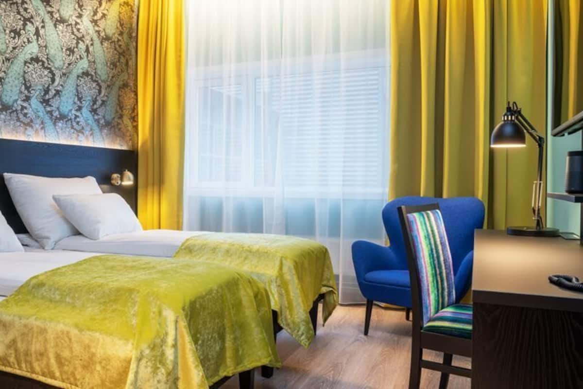 Luxe beddengoed, een minibar, een kluis op de kamer, een bureau