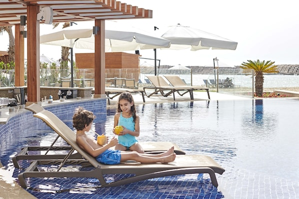 Indoor pool, open 8:00 AM to 8:00 PM, pool umbrellas, sun loungers