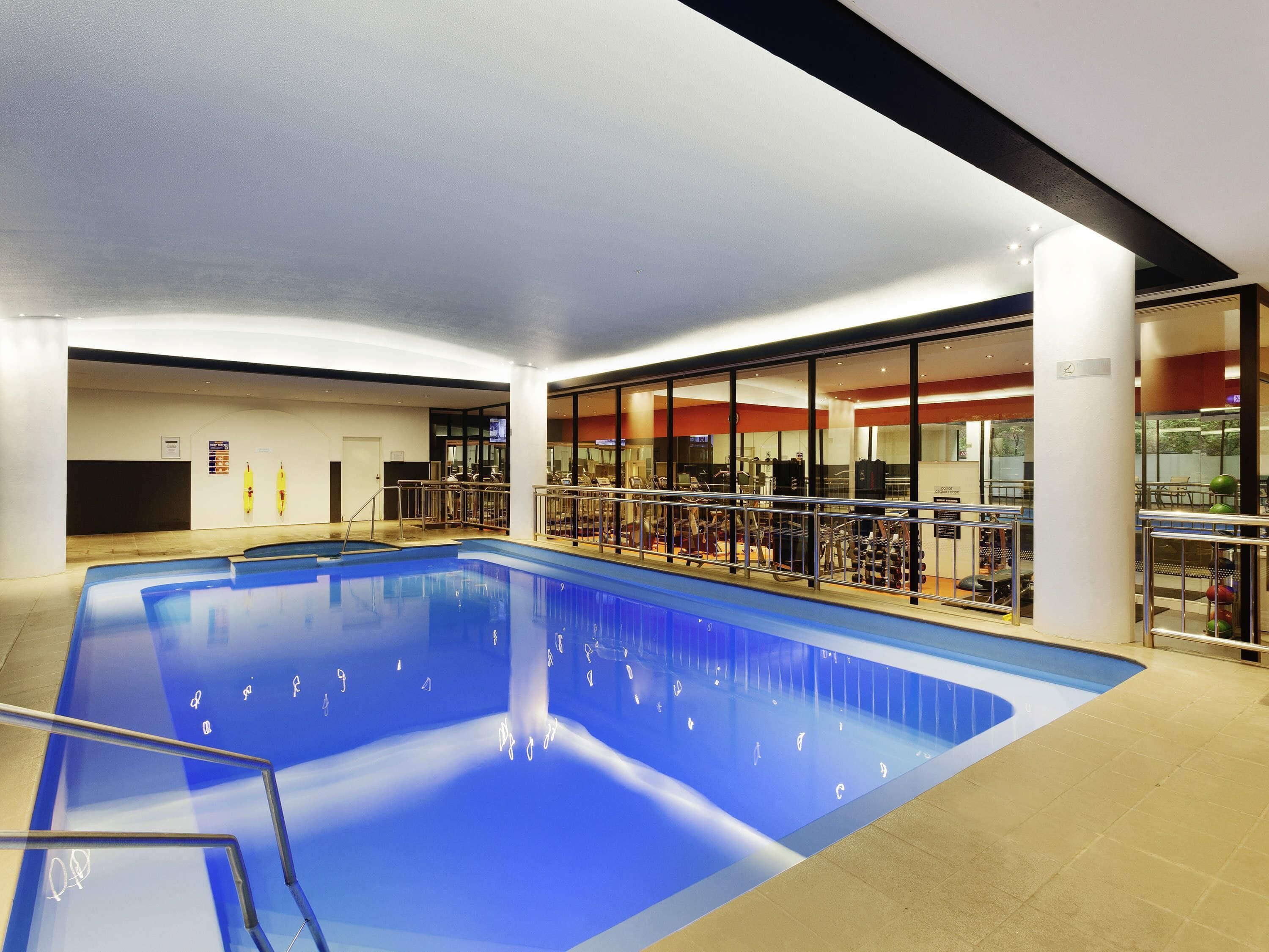 Indoor pool, open 6:00 AM to 10:00 PM, pool loungers