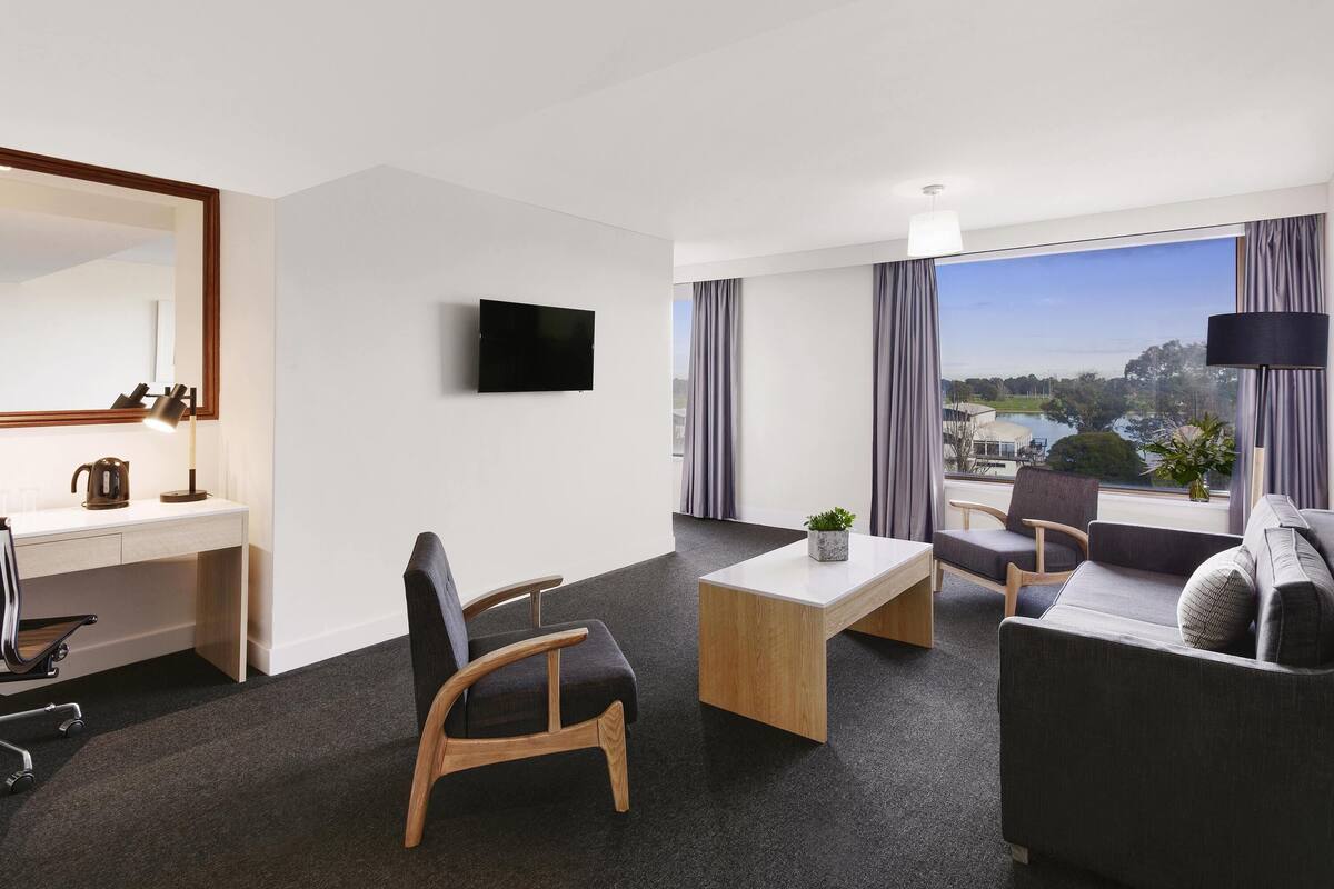 Superior Suite, 1 Bedroom, Lake View | In-room safe, desk, laptop workspace, blackout drapes