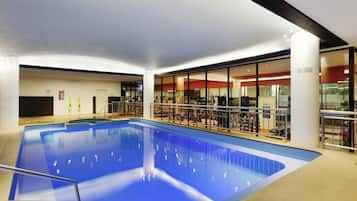 Indoor pool, open 6:00 AM to 10:00 PM, pool loungers