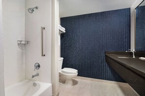 A modern bathroom with a bathtub, toilet, and sink. - Fairfield Inn & Suites by Marriott South Hill (La Crosse)