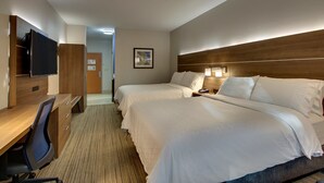 A hotel room with two beds, a desk with a chair, a flat-screen TV, and a wooden headboard. - Holiday Inn Express Hotel & Suites Austell - Powder Springs by IHG (Austell)