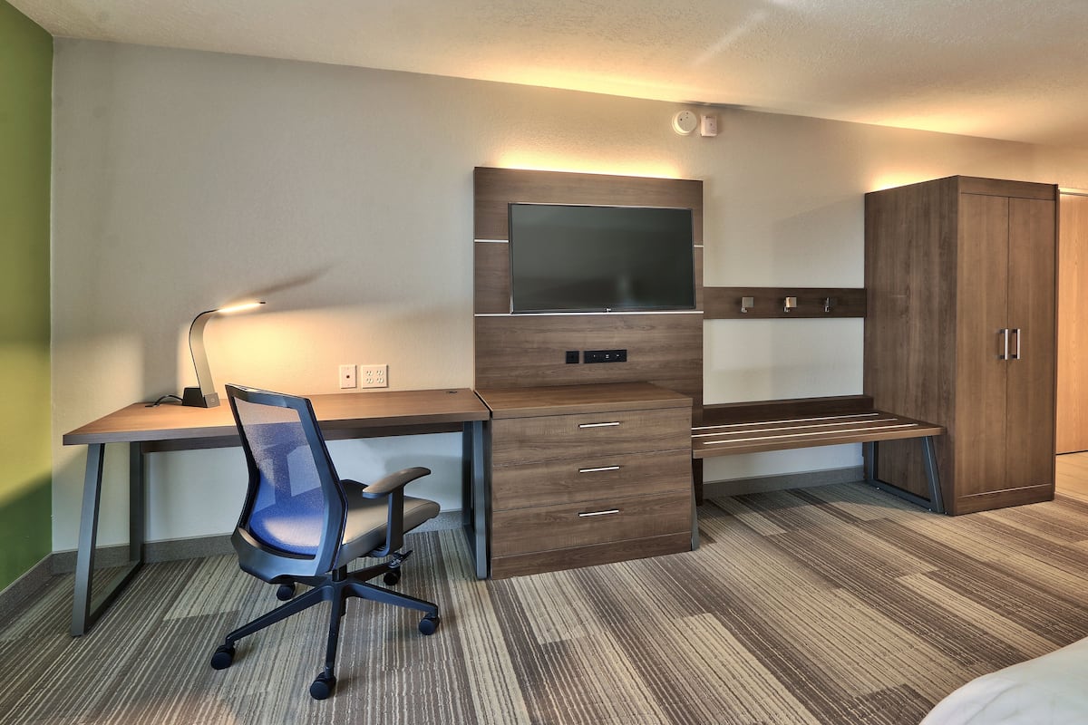 Desk, laptop workspace, blackout drapes, iron/ironing board