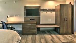 A modern hotel room with a bed, desk, chair, wardrobe, and a flat-screen TV. - Holiday Inn Express Socorro by IHG (Socorro)