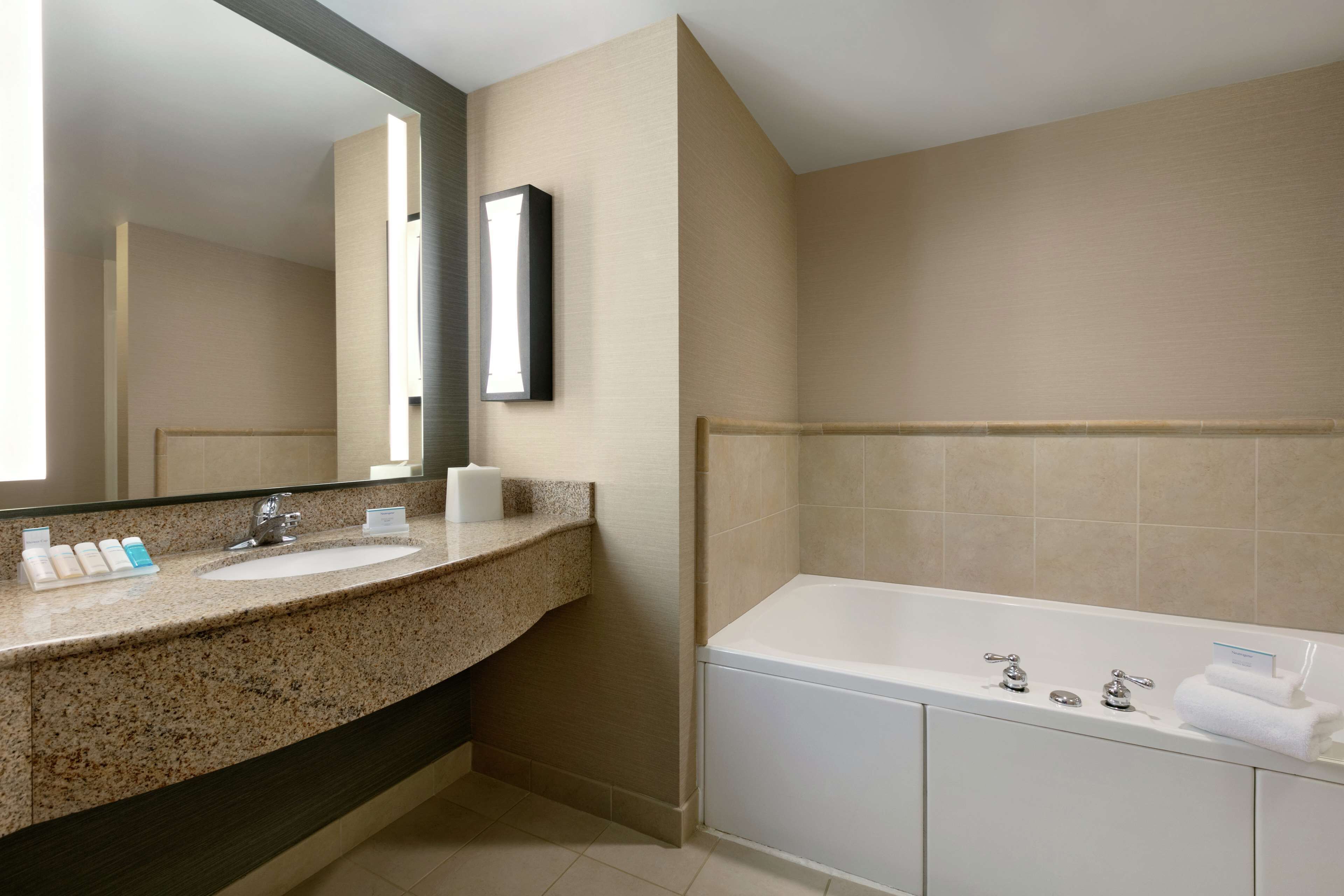 shower, designer toiletries, hair dryer, towels